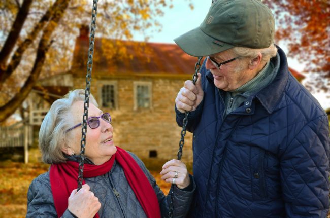 Loving elderly couple on a farm - Goldstone Financial Group